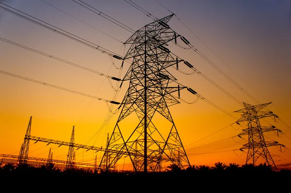 Sunset against pylon tower — Stock Photo, Image