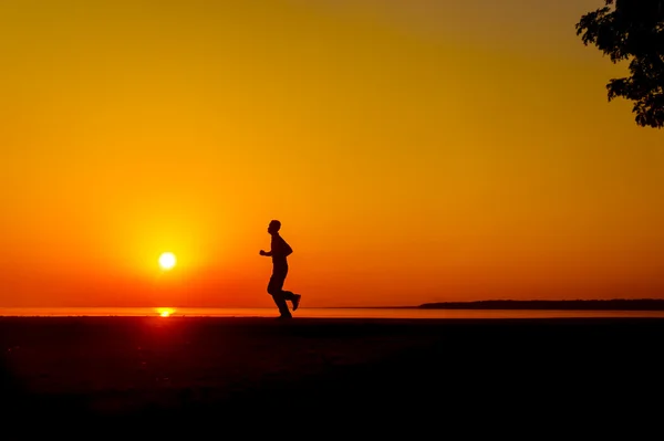 Jogging au coucher du soleil — Photo