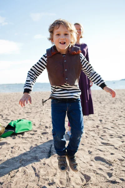 Boy jumping at beach — Stock Photo, Image