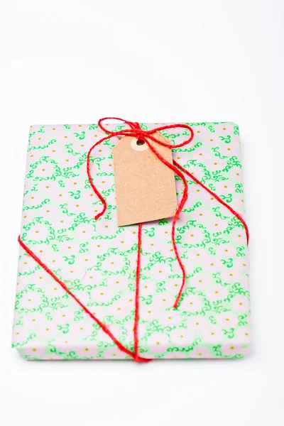 Simple gift with tag — Stock Photo, Image