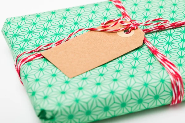 Simple gift with tag — Stock Photo, Image