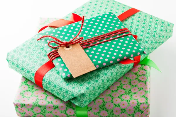 Wrapped gifts with tag — Stock Photo, Image