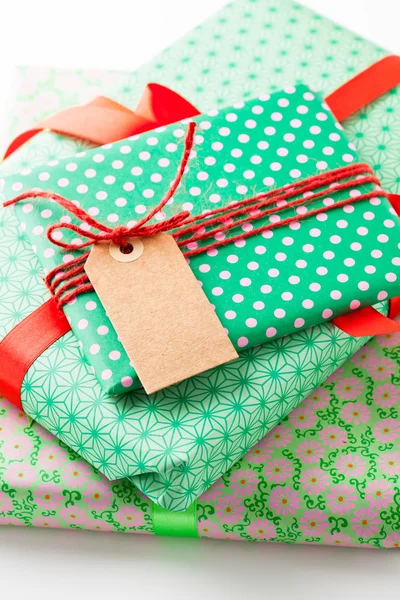 Wrapped gifts with tag — Stock Photo, Image