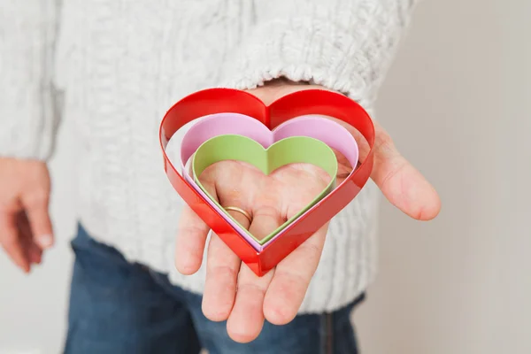 Heart symbols held in hand — Stock Photo, Image