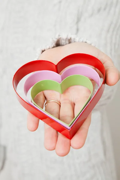 Heart symbols held in hand — Stock Photo, Image