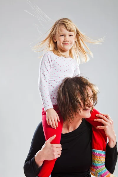 Happy woman and girl playing — Stock Photo, Image