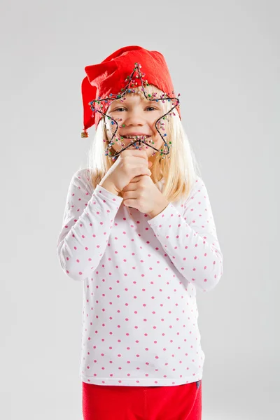 Glückliches junges Mädchen mit Weihnachtssterndekoration — Stockfoto
