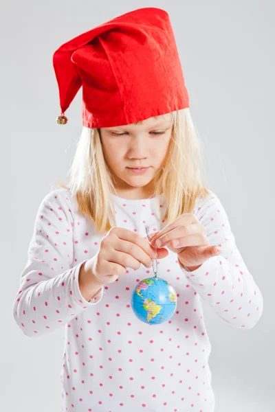 Young girl holding world in hands — Stock Photo, Image