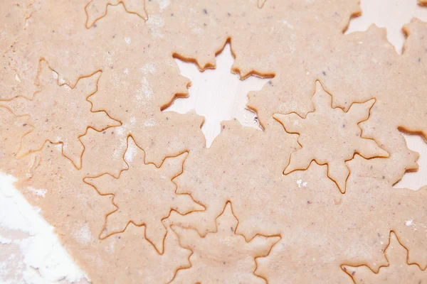 Gingerbread dough with star shapes — Stock Photo, Image