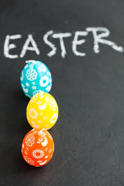 Colorful Easter egg shaped candles and text — Stock Photo, Image