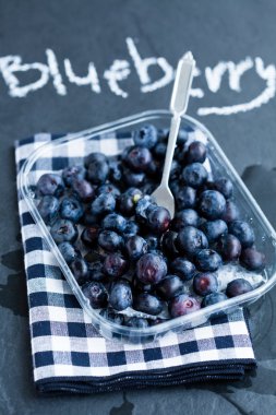 Fresh blueberries and fork clipart