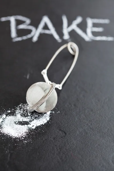 Sieve and icing sugar — Stock Photo, Image