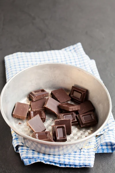 Bowl of chocolate pieces — Stock Photo, Image