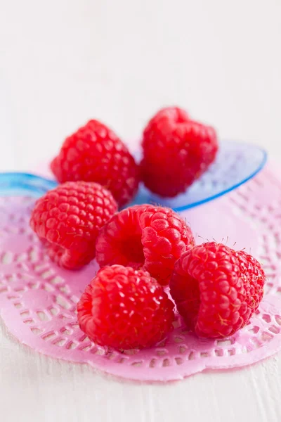 Fresh raspberries and spoon — Stock Photo, Image