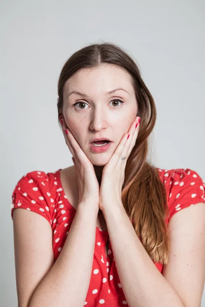 Surprised looking attractive woman — Stock Photo, Image