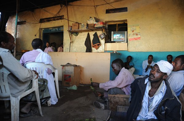 Men use Khat during a meeting in a cafe.