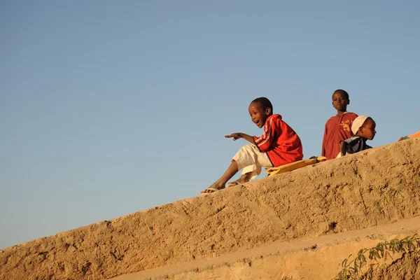 Somali boys are riding on the hill of concrete — Stock Photo, Image