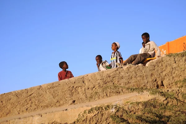 Somali boys are riding on the hill of concrete — Stock Photo, Image