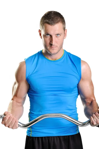 Muscular athlete man exercising on a white background — Stock Photo, Image