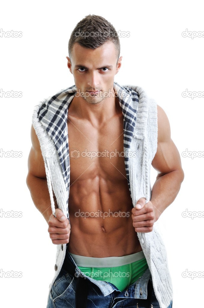 Powerful muscular man posing on a white background