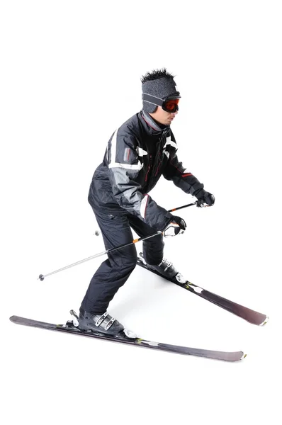 Uno sciatore maschile con attrezzatura completa su fondo bianco — Foto Stock