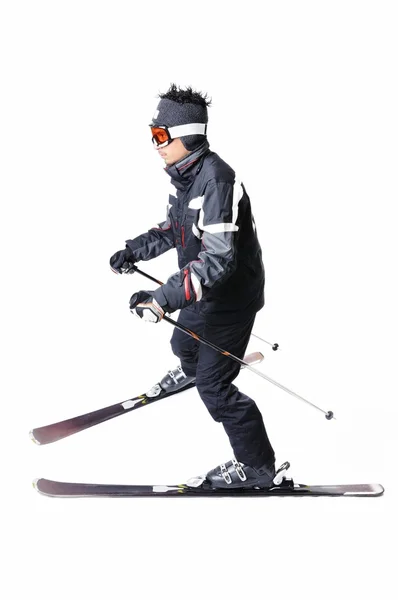 One male skier skiing with full equipment on a white background — Stock Photo, Image