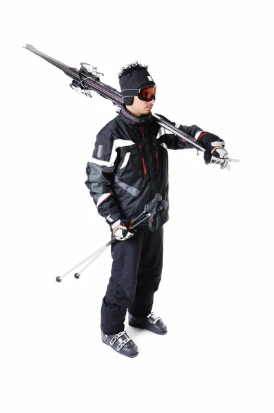 One male skier showing how to carry full equipment — Stock Photo, Image