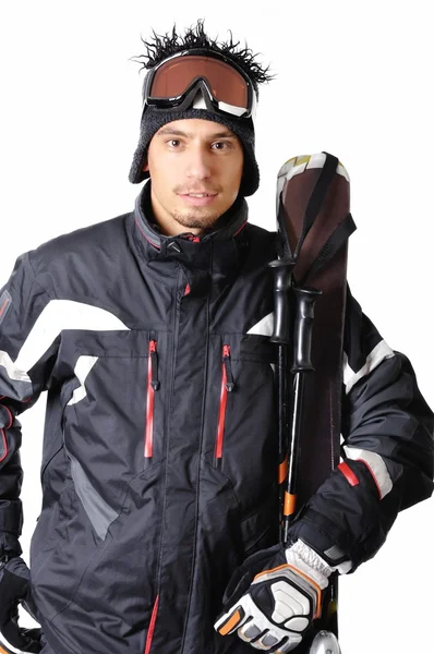 Un esquiador masculino posando con equipo completo sobre un fondo blanco —  Fotos de Stock