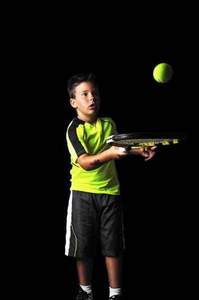 Handsome boy with tennis equipment — Stock Photo, Image