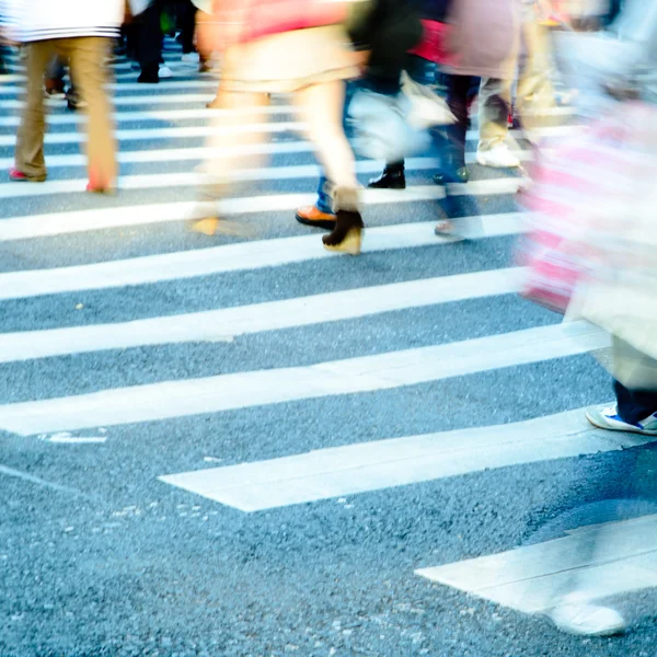 Crowd on zebra crossing street Stock Photo