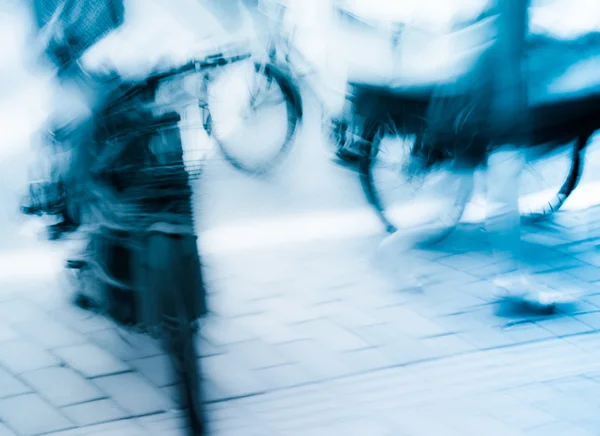 On motor bike and bicycle at big city street, — Stock Photo, Image