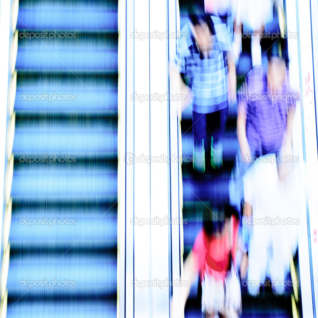 business passenger on a modern escalator