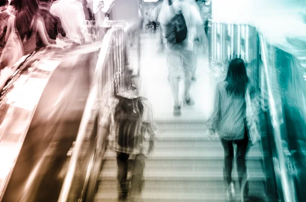 Business on escalator abstract blur — Stock Photo, Image