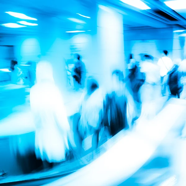 Business on escalator abstract blur — Stock Photo, Image