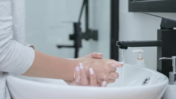 Caucasian woman wash hands with soft soap — Stock Video
