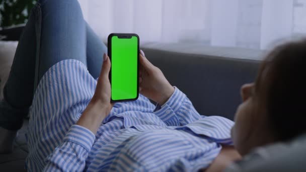View Shoulders Woman Lying Couch Using Smartphone Green Screen — Stock Video