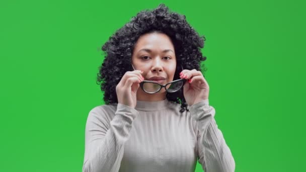 Portrait African American Woman Puts Eyeglasses Waving Hand Greeting Isolated — 图库视频影像