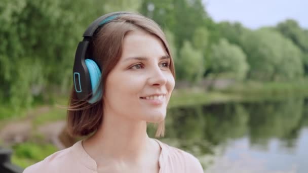 Close Happy Woman Listening Music Headphones Walking River Bank Slow — Stockvideo