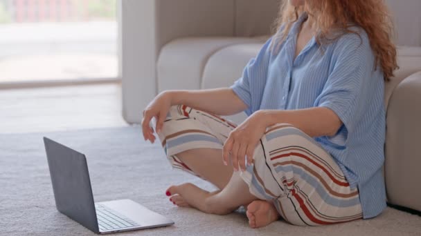 Unrecognizable Woman Sitting Floor Crossed Legs Watching Online Yoga Class — Stock video