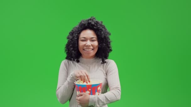 African American Cheerful Woman Laughing Eating Popcorn Watching Comedy Film — Stockvideo