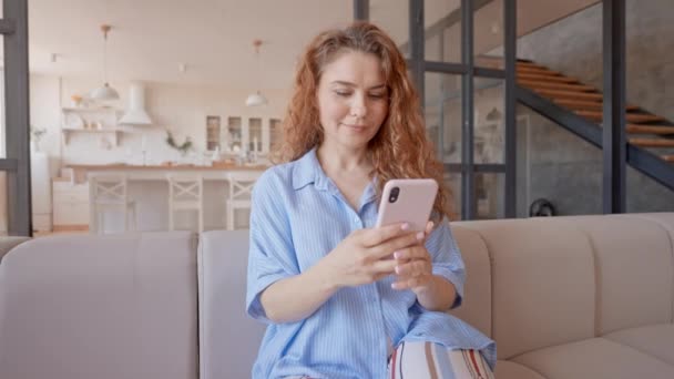 Cheerful Lady Using Device Browsing Scrolling Social Media Using App — Wideo stockowe