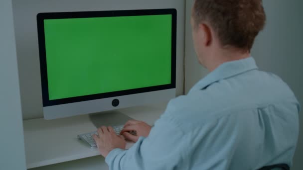 Man Sitting Desk Typing Keyboard Computer Green Screen Working Home — Video Stock