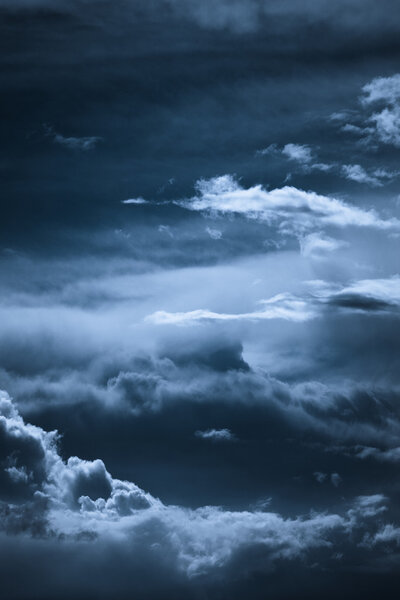 Dark blue night sky with clouds formation
