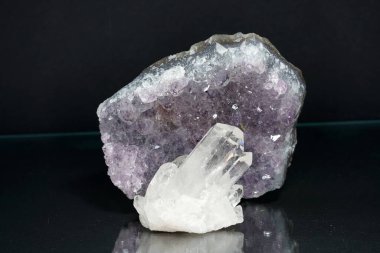 Quartz with mineral inclusions in the studio in front of a background photographed in Marco mode                      clipart