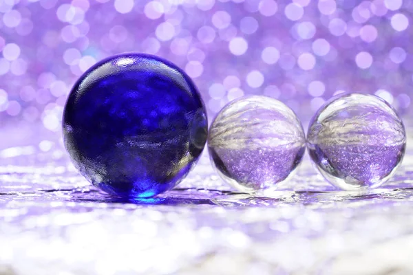 Glass ball in modern colors photographed in the studio to be used as a background