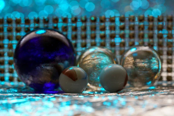 Glass ball in modern colors photographed in the studio to be used as a background