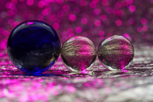 Glass ball in modern colors photographed in the studio to be used as a background