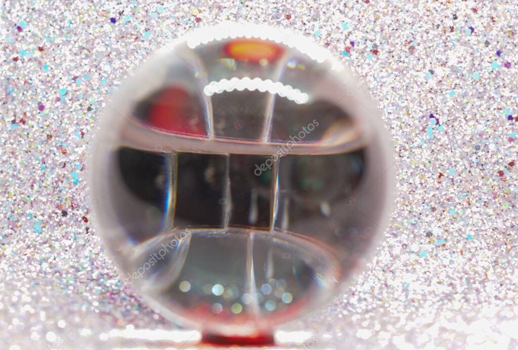 Glass ball in modern colors photographed in the studio to be used as a background