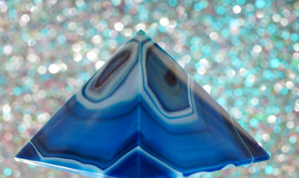 Blue violet pyramid of agate with quartz inclusions or worked as a disc                  
