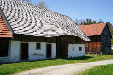 farm house in Bavaria with many details from the roof to wooden windows and doors